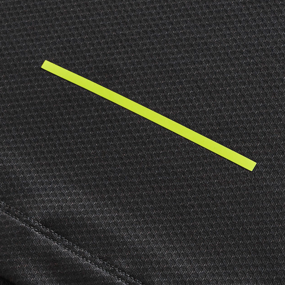 A yellow horizontal line on a textured dark gray fabric background, inspired by Canterbury's Tempo+ Training Tee (H225).