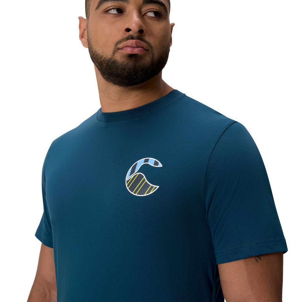 Man wearing the Canterbury Uglies Logo T-Shirt, featuring a stylized "C" logo on the left chest, looking slightly to his left against a plain white background.
