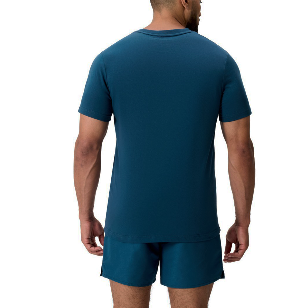 A man faces away, wearing a blue Uglies Logo T-Shirt by Canterbury and matching blue shorts against a white background.