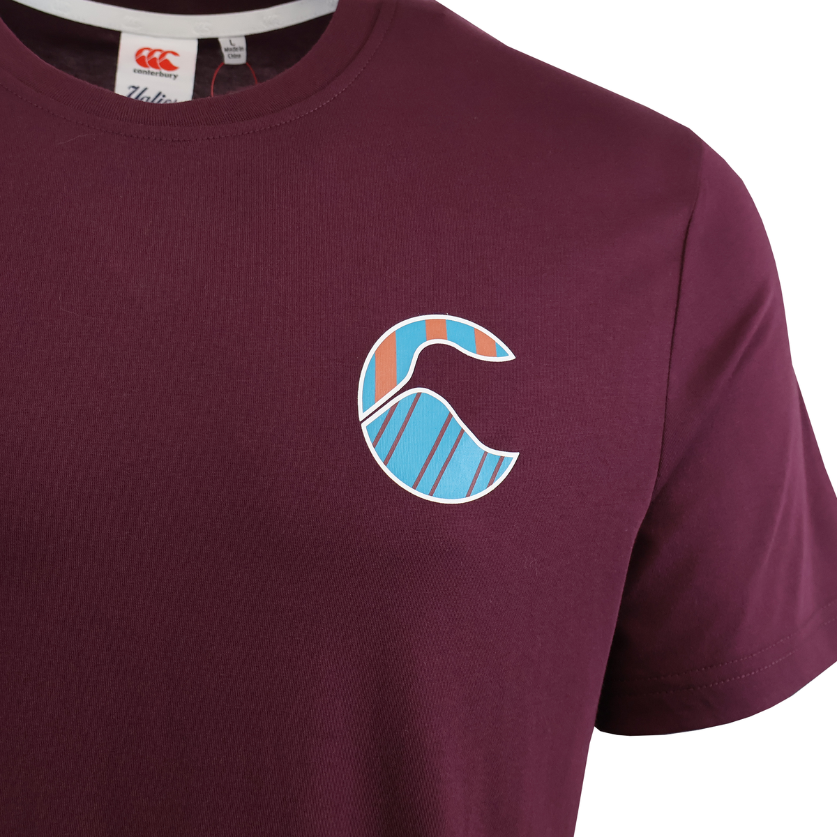 The Canterbury Uglies Logo T-Shirt is a maroon rugby tee with a colorful, abstract wave design on the left chest—delivering a bold, sporty style.