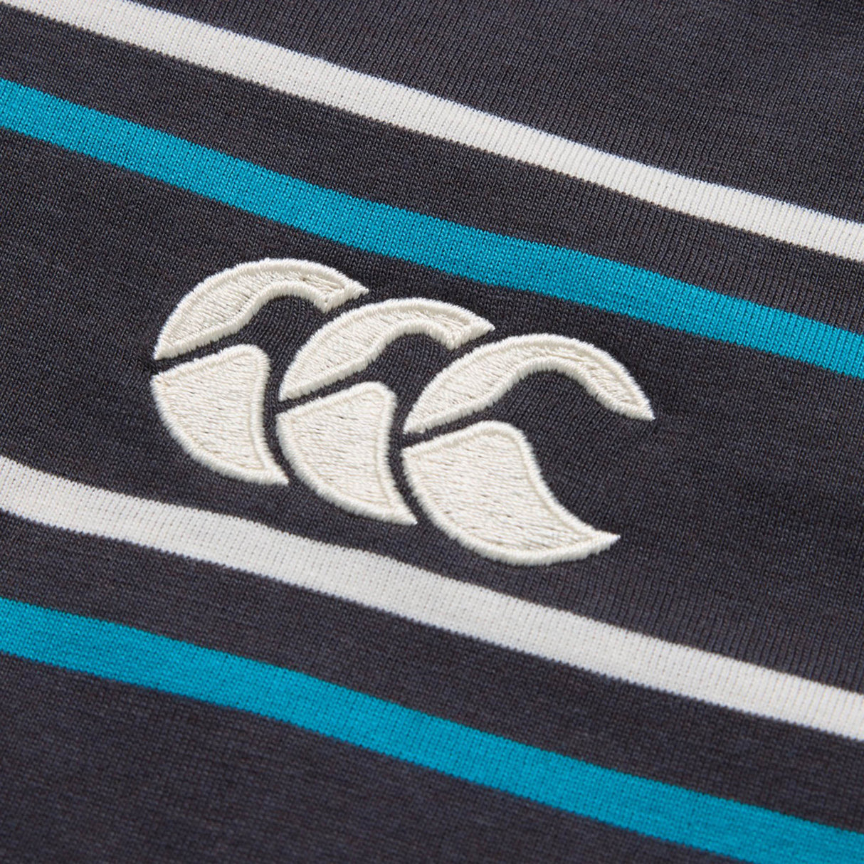 Introducing the Canterbury Yarn Dye Stripe Polo by Canterbury—a classic navy blue polo shirt with white and blue stripes, adorned with the signature embroidered white Canterbury logo featuring three overlapping curves. Inspired by traditional rugby polo designs, this timeless athletic piece is perfect for a sporty, classic look.