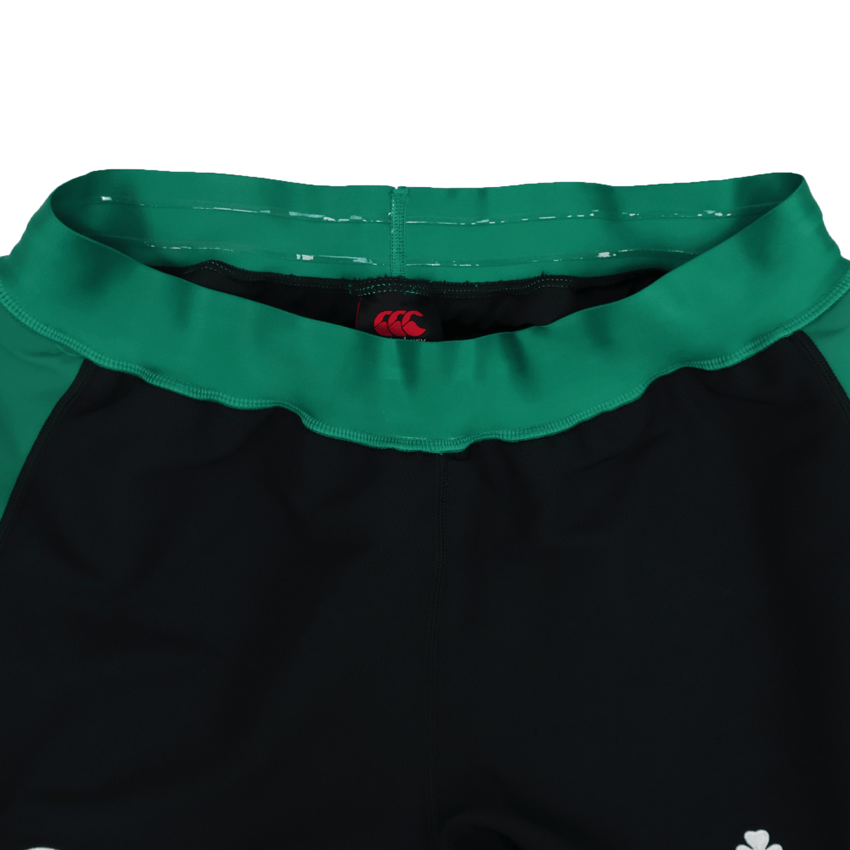 Close-up of the waistband on the Ireland 25/26 Alternate Match Short by Canterbury, black and green with a red Canterbury logo on the inner waistband.