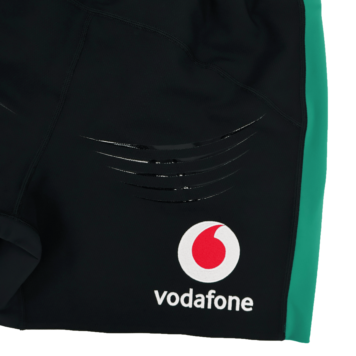 Close-up of the Ireland 25/26 Alternate Match Short by Canterbury—black rugby shorts with a green side panel, Vodafone logo, and black stripes. Perfect for match day.