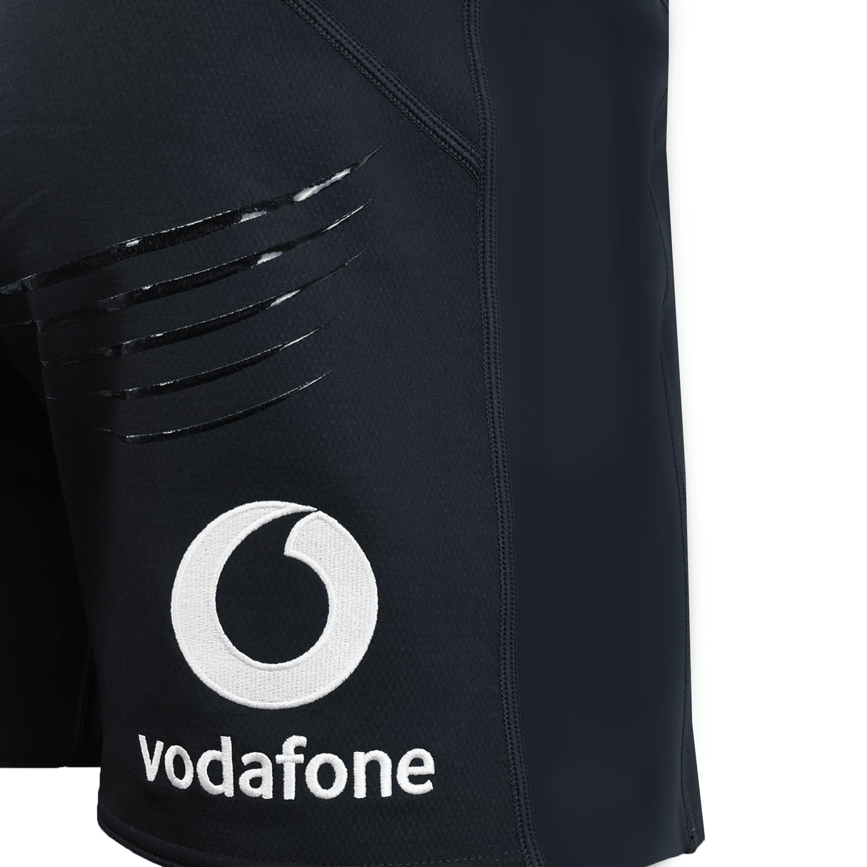 Close-up of the Ireland 25/26 Training Short by Canterbury in black, showing glossy claw mark designs and a white Vodafone logo with text on the left leg.