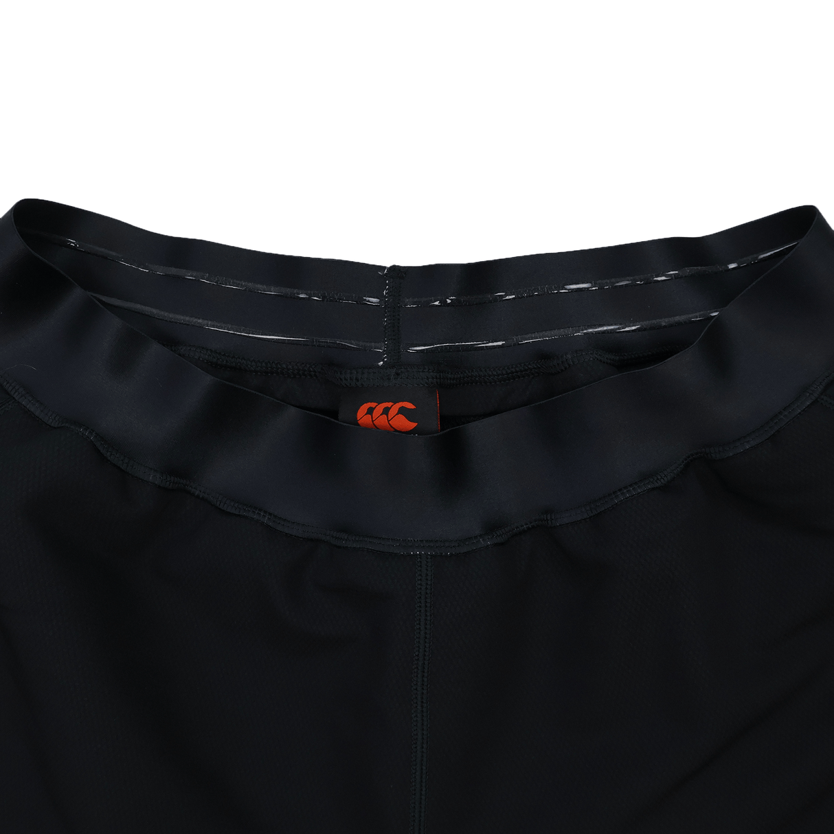 Close-up of the waistband on the Ireland 25/26 Training Short by Canterbury, featuring a black design and an orange logo on the inner waistband.