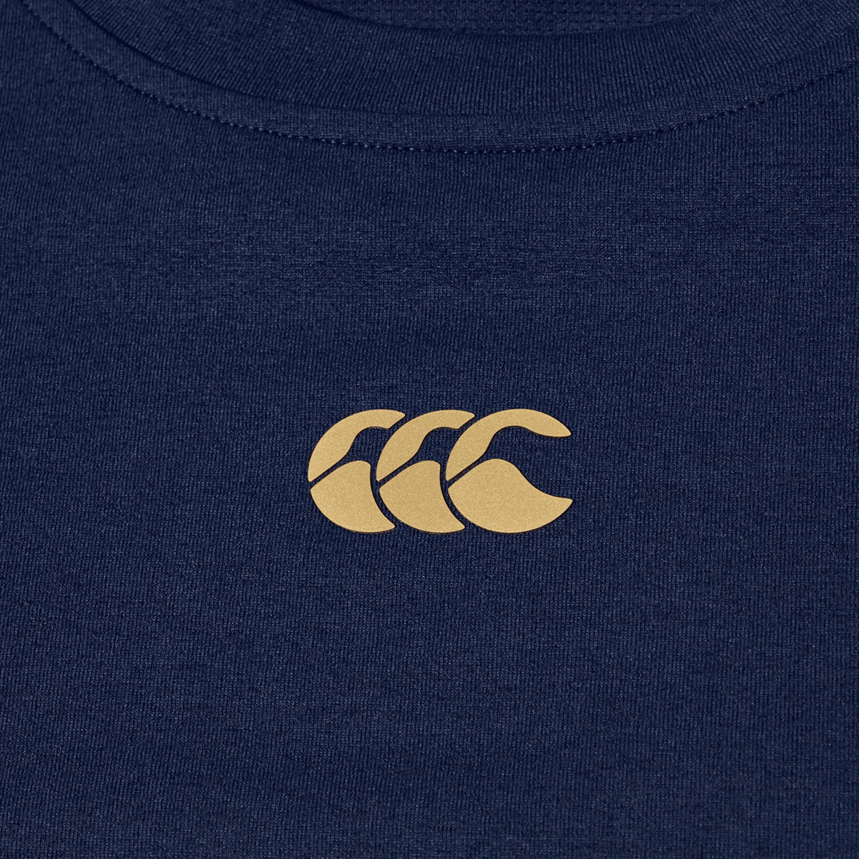 The Canterbury Everest Dart Tech T-Shirt is a navy blue, quick-drying tech tee with a small light brown "CCC" logo centered on the chest.
