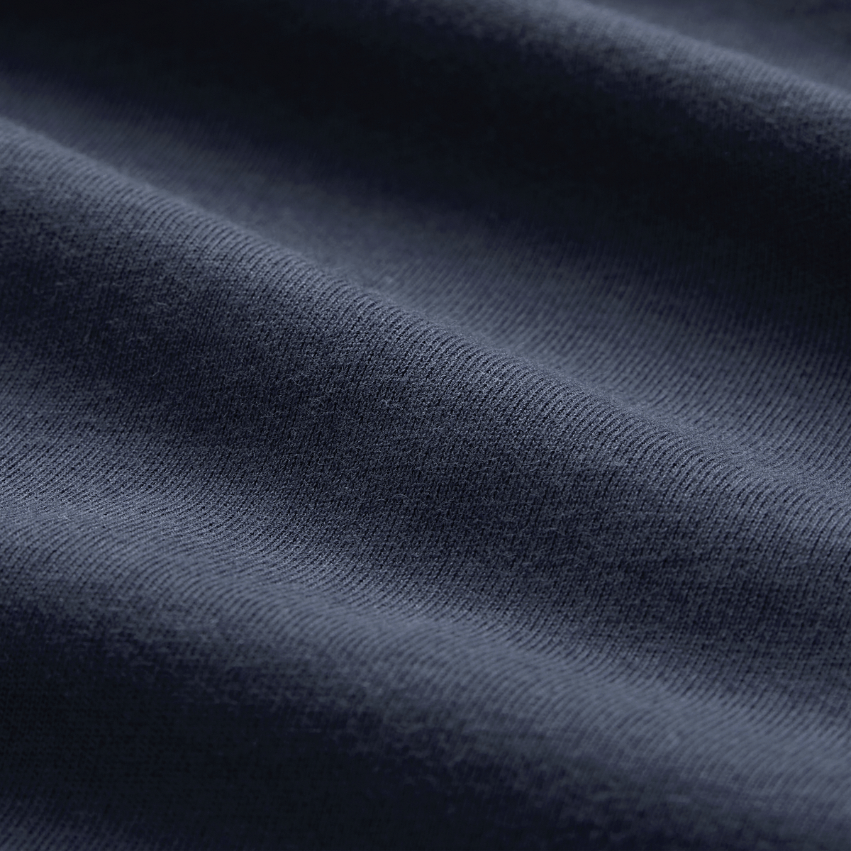 Close-up of dark blue Canterbury fabric with visible texture and soft folds—ideal for the Ireland 26/27 Summer Tour Team Cotton T-Shirt by Canterbury.