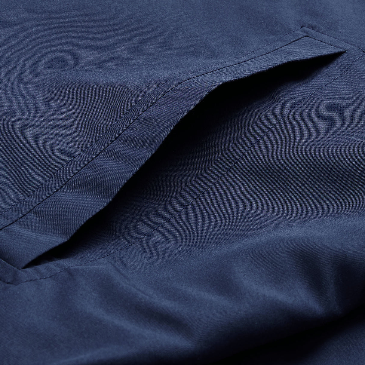 Close-up of the Ireland 26 Legends 1/4 Zip Jacket by Canterbury in navy blue, highlighting a single welt pocket with neat stitching.