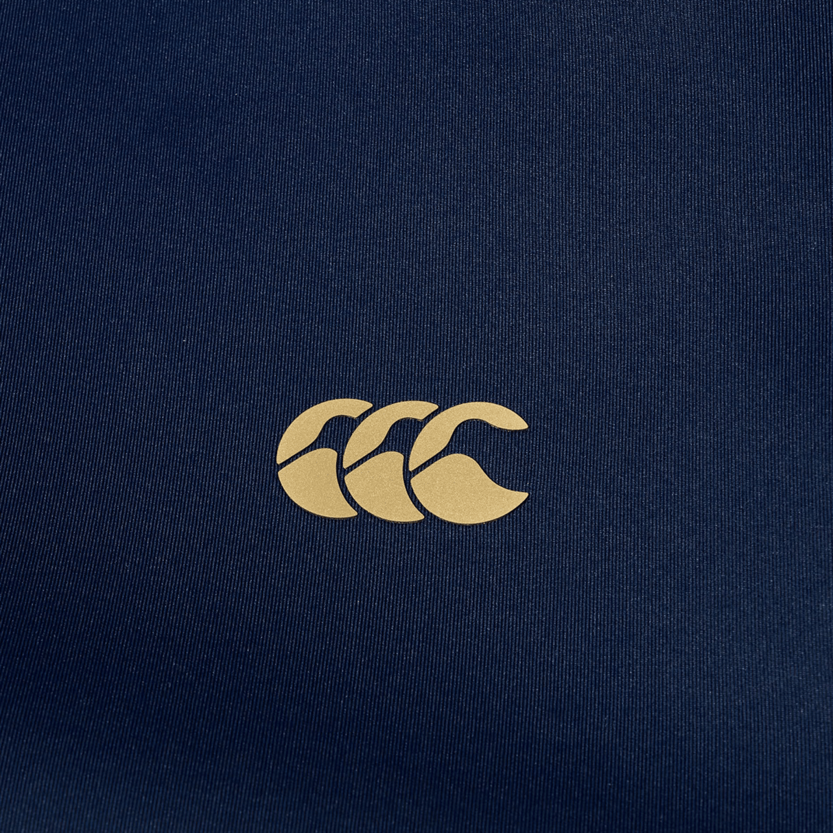 The Canterbury Everest Full Zip Hoodie features a beige Canterbury logo with three overlapping Cs on navy blue fabric, combining style and performance for your rugby training needs.