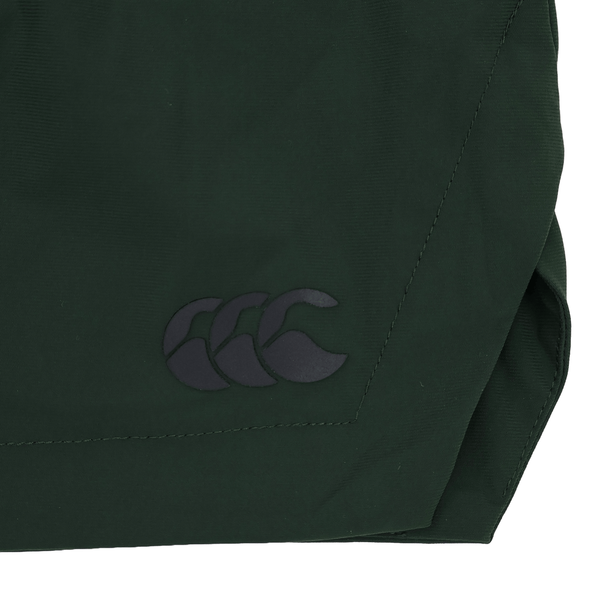 Close-up of a dark green four-way stretch fabric used in the Canterbury Everest Woven Short 5", featuring a black Canterbury logo with three overlapping curved shapes.
