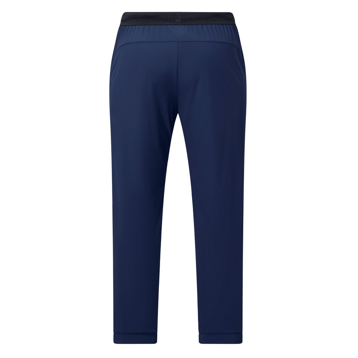 The Canterbury Everest Woven Pant 30" in navy blue is shown from the back, featuring a black elastic waistband, straight legs, and sweat-wicking fabric for all-day comfort.