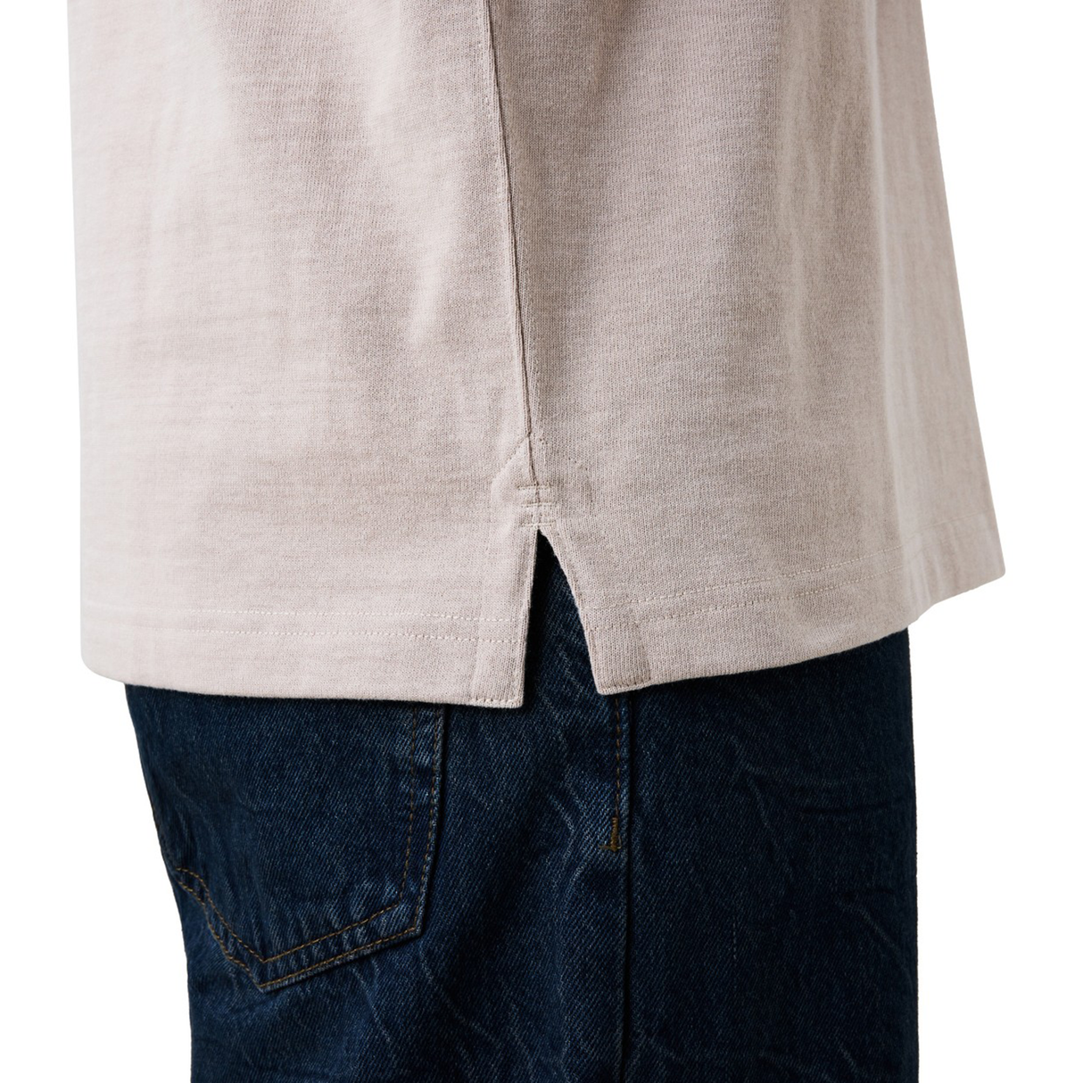 A close-up side view of a person wearing the Canterbury Stripe Classic Rugby Jersey by Canterbury, paired with dark blue denim jeans.