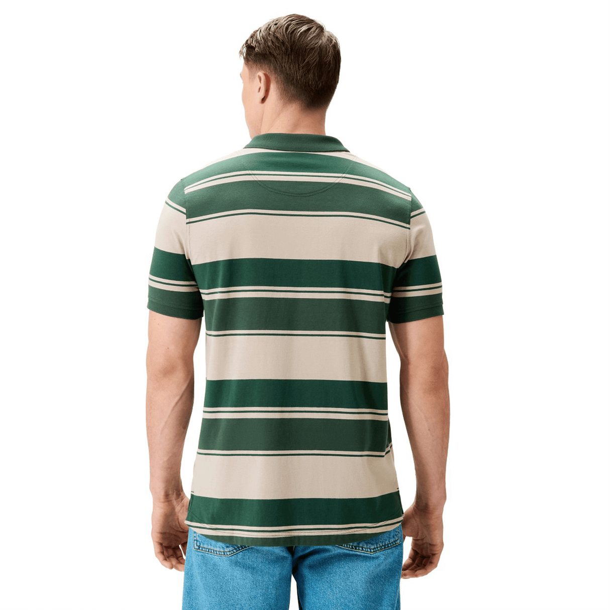 A man stands with his back to the camera, wearing a Canterbury Yarn Stripe Polo in green and beige stripes by Canterbury, paired with blue jeans.