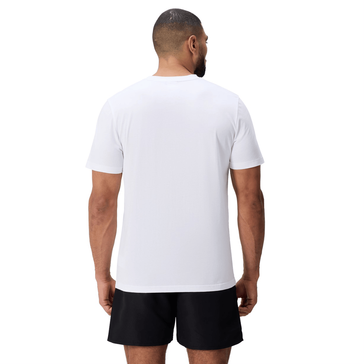 A man stands facing away, wearing a Canterbury Uglies Logo T-shirt in white against a white background.