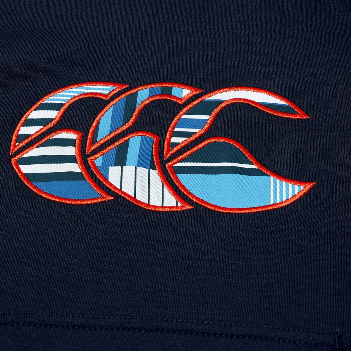 Featuring navy fabric with three overlapping “C” shapes outlined in red and filled with blue and white striped patterns, the Canterbury Youth Uglies Logo Hoodie by Canterbury brings bold rugby style inspired by the iconic Uglies collection—perfect for making a statement on and off the field.