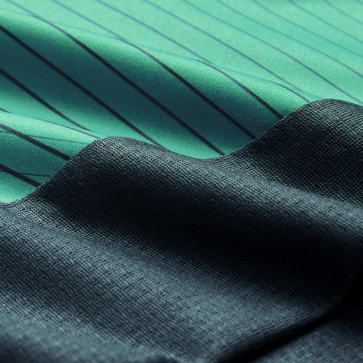 Close-up of two fabrics: one green with thin black stripes, inspired by the Canterbury Ireland 26/27 Summer Tour Superlight Training Tank, and one textured dark blue. The fabrics overlap diagonally.