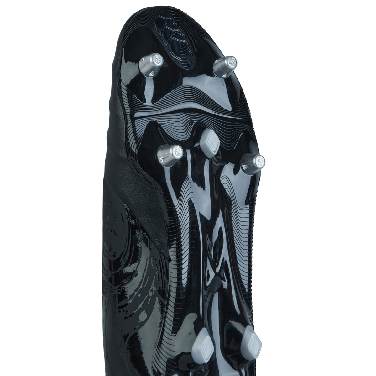 Close-up view of the bottom of a Canterbury Phoenix Genesis Team SG rugby boot in Black/Silver Metallic, showcasing six metal studs arranged in varying positions on a reflective surface.
