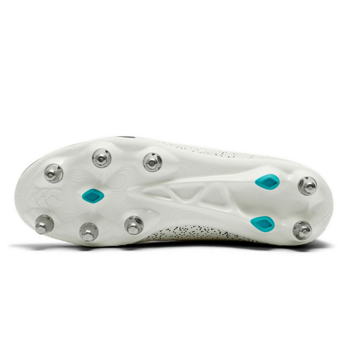 The image shows the bottom view of the Canterbury Stampede Groundbreak Pro SG rugby boot in white and Baltic Green, featuring eight metal studs and three blue plastic studs in a soft ground configuration.