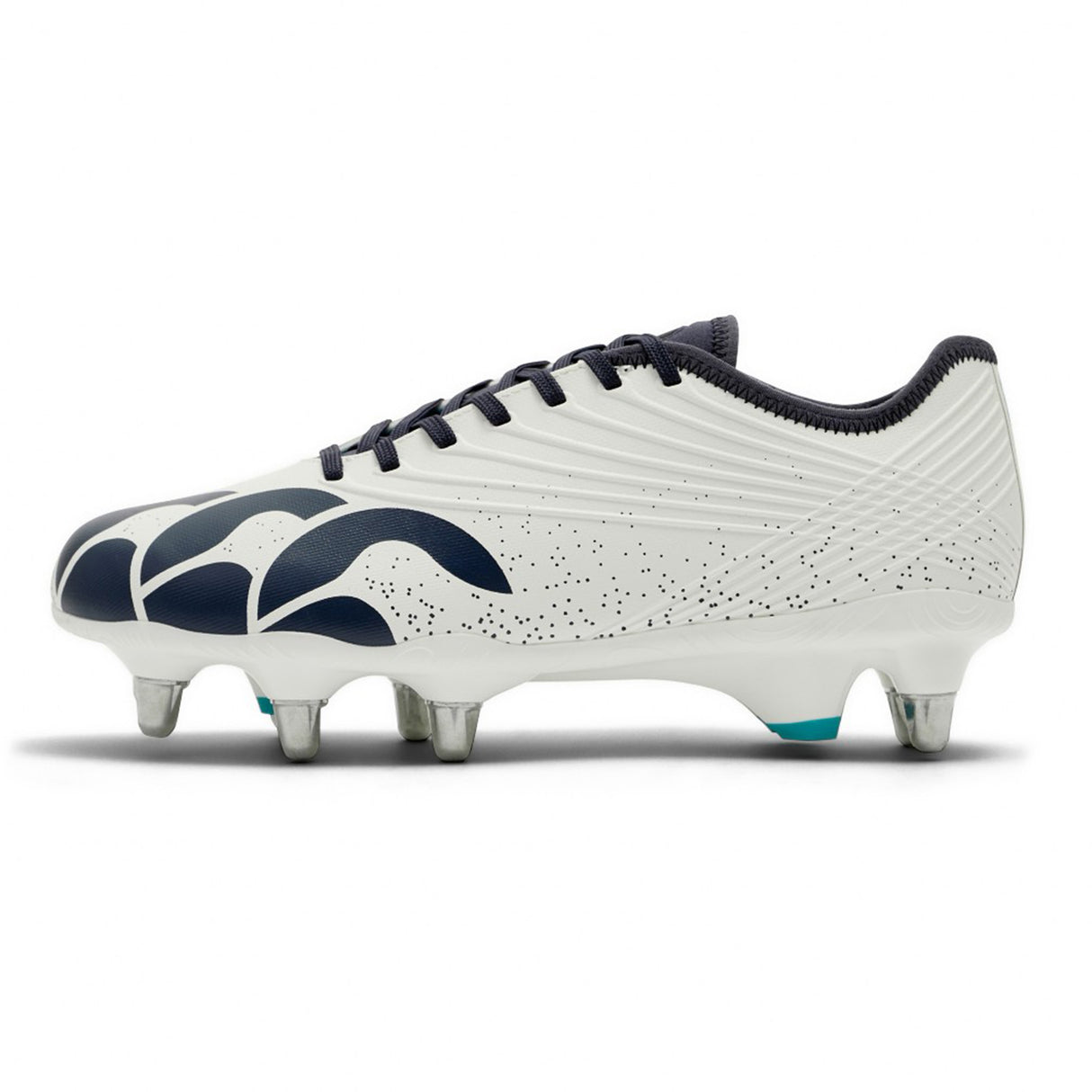 The Canterbury Stampede Groundbreak Pro SG - White/Baltic Green rugby boot features a white upper with black laces, a navy abstract design, dotted pattern detailing, and six metal studs on the sole—engineered by Canterbury as soft ground rugby boots to deliver exceptional traction and performance.