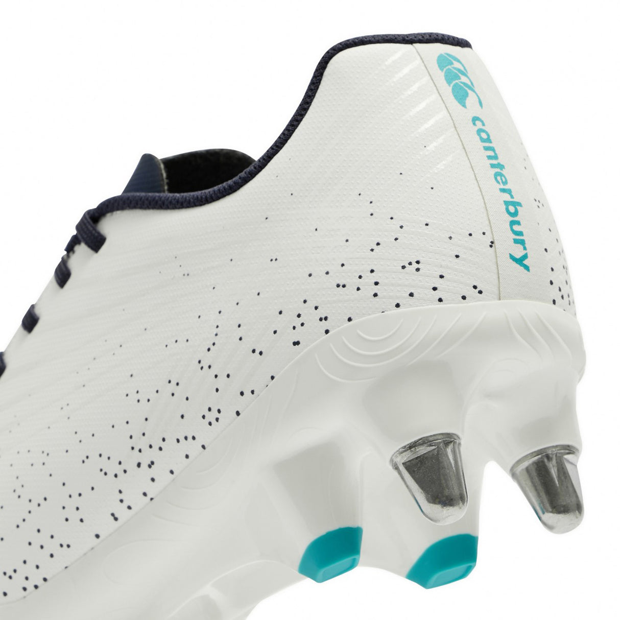 Close-up of the heel and studs of the Canterbury Stampede Groundbreak Team SG rugby boot in white and baltic green, designed for soft ground and ideal for forwards, featuring metal and green-tipped studs.