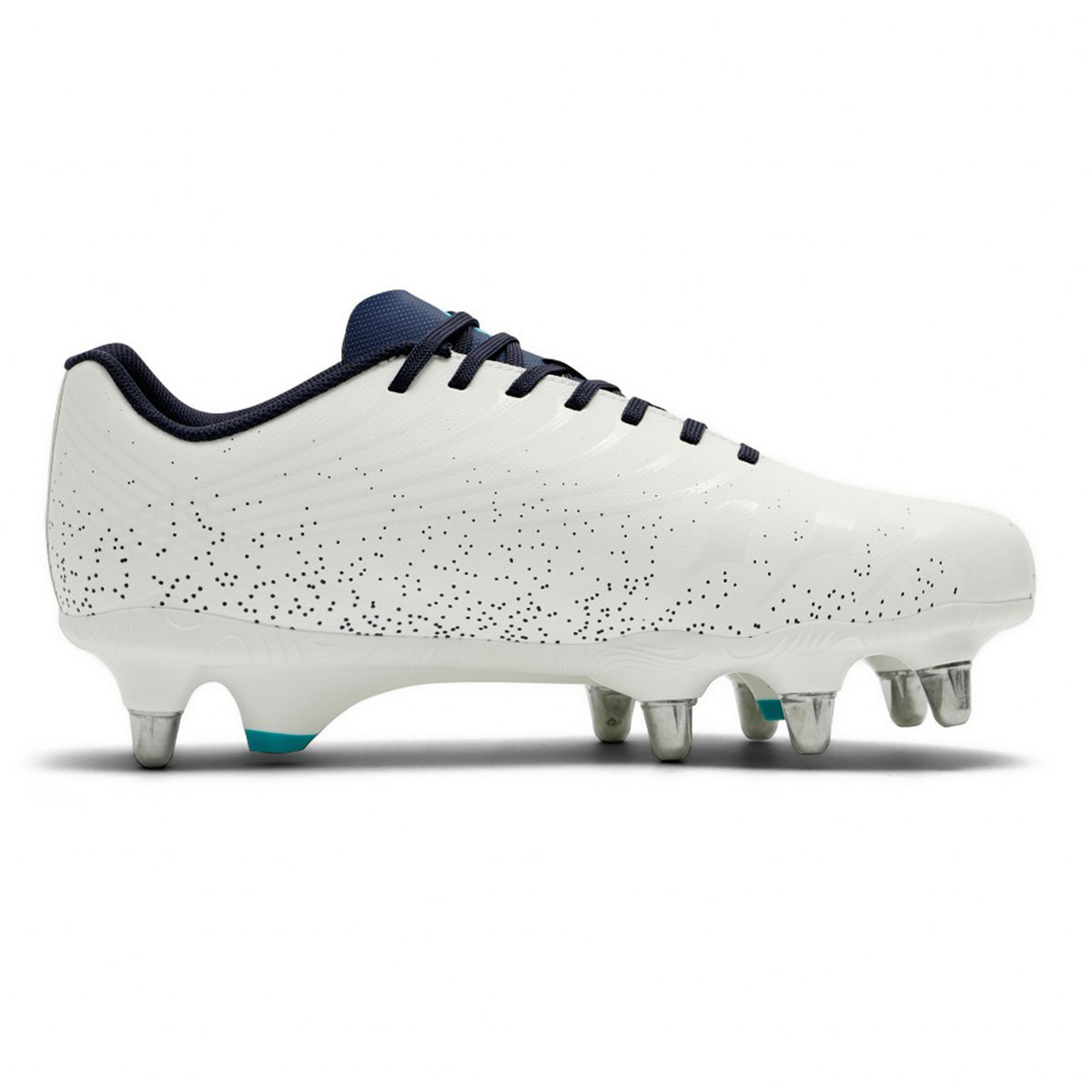 The Canterbury Stampede Groundbreak Team SG rugby boot in White/Baltic Green features a white design with black speckles, black laces, a dark collar, and six metal studs on the sole for optimal grip on soft ground surfaces. Shown in a side view, it’s ideal for forwards seeking enhanced stability and traction.