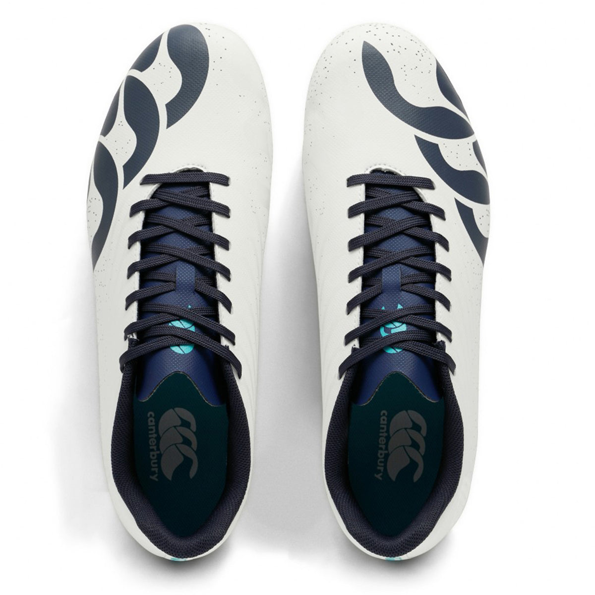 A pair of Canterbury Stampede Groundbreak Team SG boots in white with Baltic green accents, featuring black laces and abstract black patterns on the sides, viewed from above; these versatile rugby boots are designed for forwards playing on soft ground.