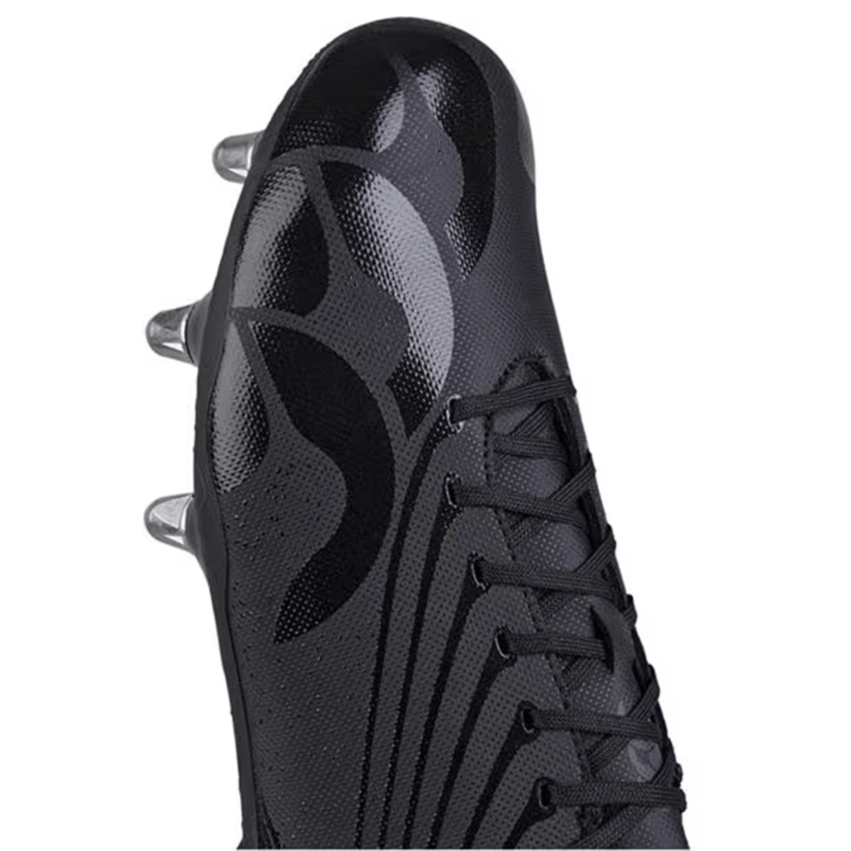 Close-up of a sleek black soccer cleat with a textured surface and laces, featuring Canterbury's Stampede Performance Stud Pack metallic sole. Ideal for top performance seekers.