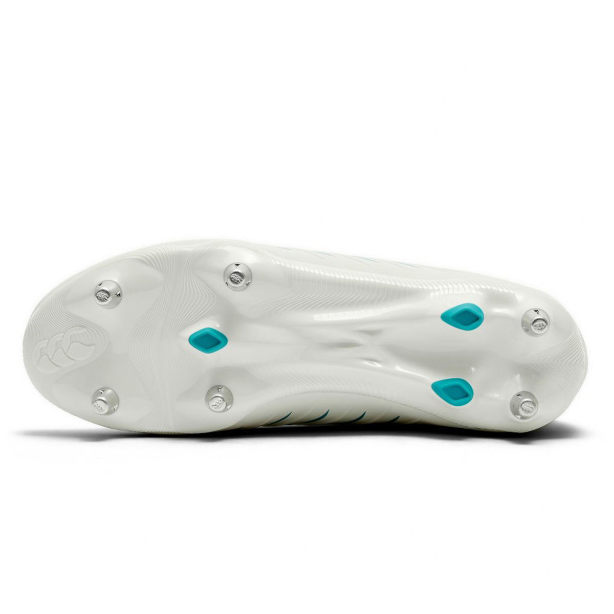 Bottom view of a Canterbury Phoenix 2.0 Pro SG rugby boot in White/Baltic Green featuring six metal studs and two Baltic Green accents, engineered for optimal traction on grass—ideal for forwards who need stability and grip in all match conditions.