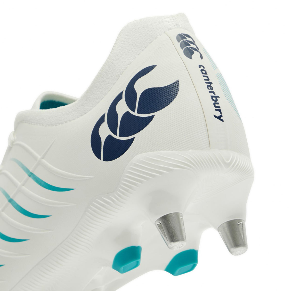 Close-up of the heel of a white Canterbury Phoenix 2.0 Pro SG rugby boot with silver studs, showcasing a Baltic Green Canterbury logo and stripes—ideal soft ground boots for forwards who need superior grip and power.