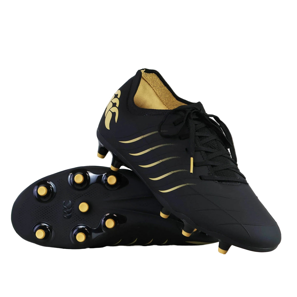 A pair of Canterbury Phoenix 2.0 Pro FG - Black soccer cleats, one standing upright and the other lying on its side to reveal the sole and stud pattern. Designed by Canterbury as Firm Ground Boots, these cleats provide lightweight power for dynamic play on natural grass pitches.