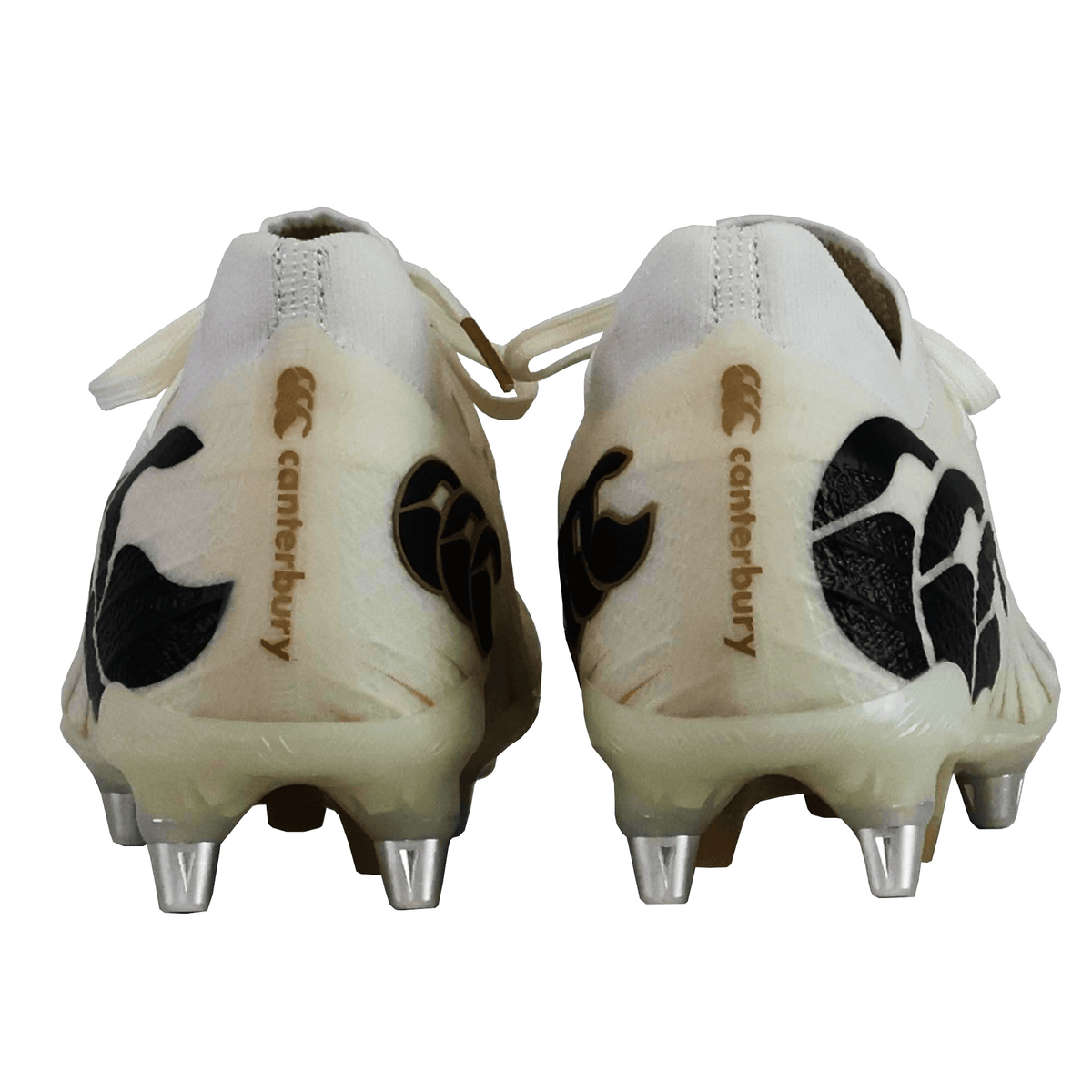 Rear view of Canterbury Speed Falcon Elite SG rugby boots in white, featuring metal studs and black patterns—ideal soft ground boots for dynamic play.
