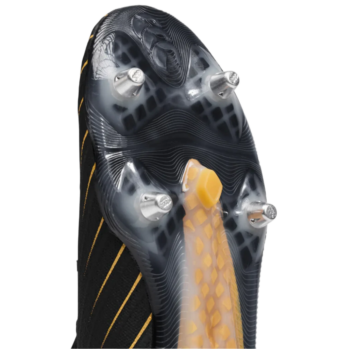 Close-up of the sole of the Canterbury Speed Falcon Elite SG, showing metal studs, a textured yellow midfoot support, and a black upper with yellow stripes.