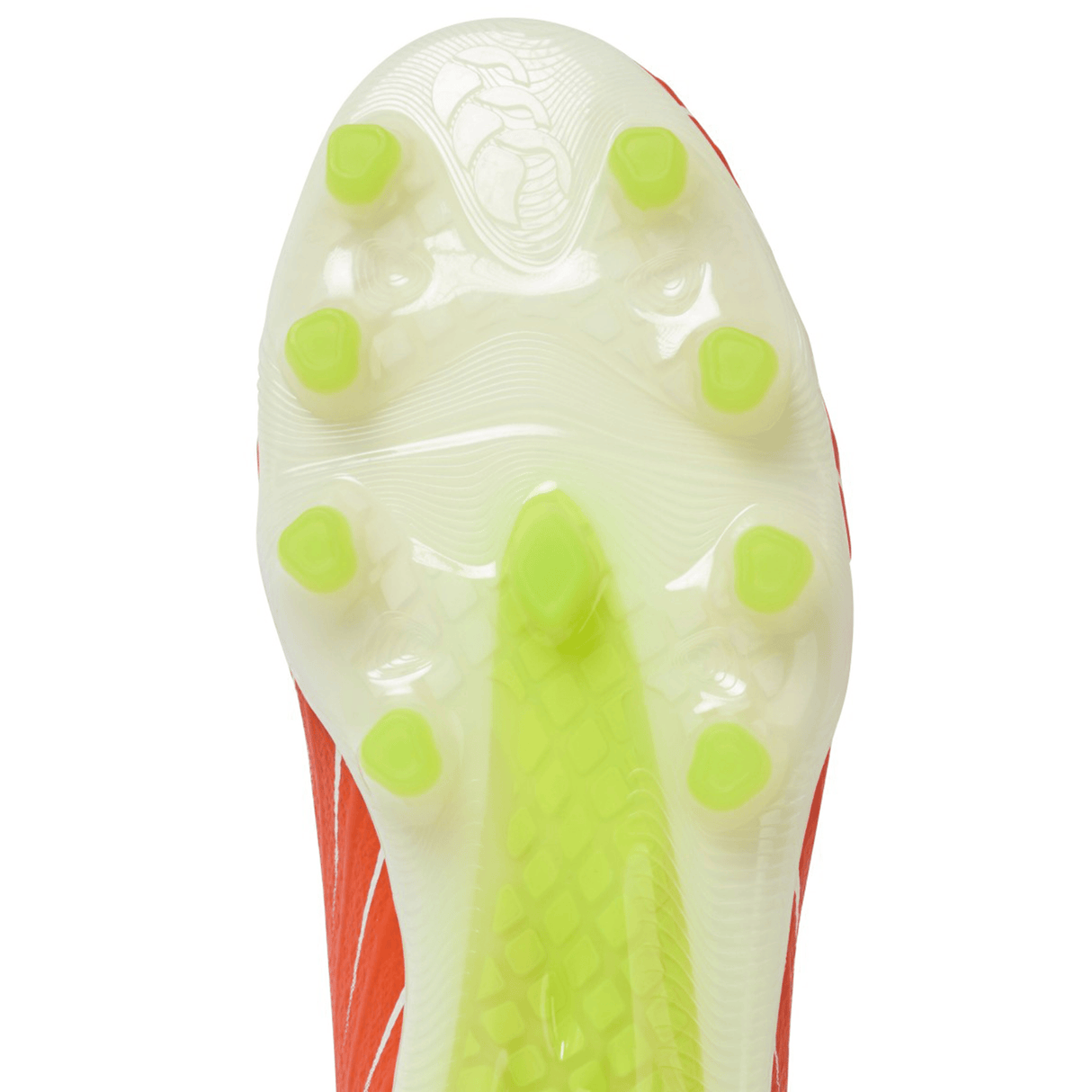 Close-up of the Canterbury Speed Falcon Elite FG in Tangerine Tango/Snow White, featuring a translucent soleplate with green studs for firm ground—these lightweight football boots offer excellent traction and agility.