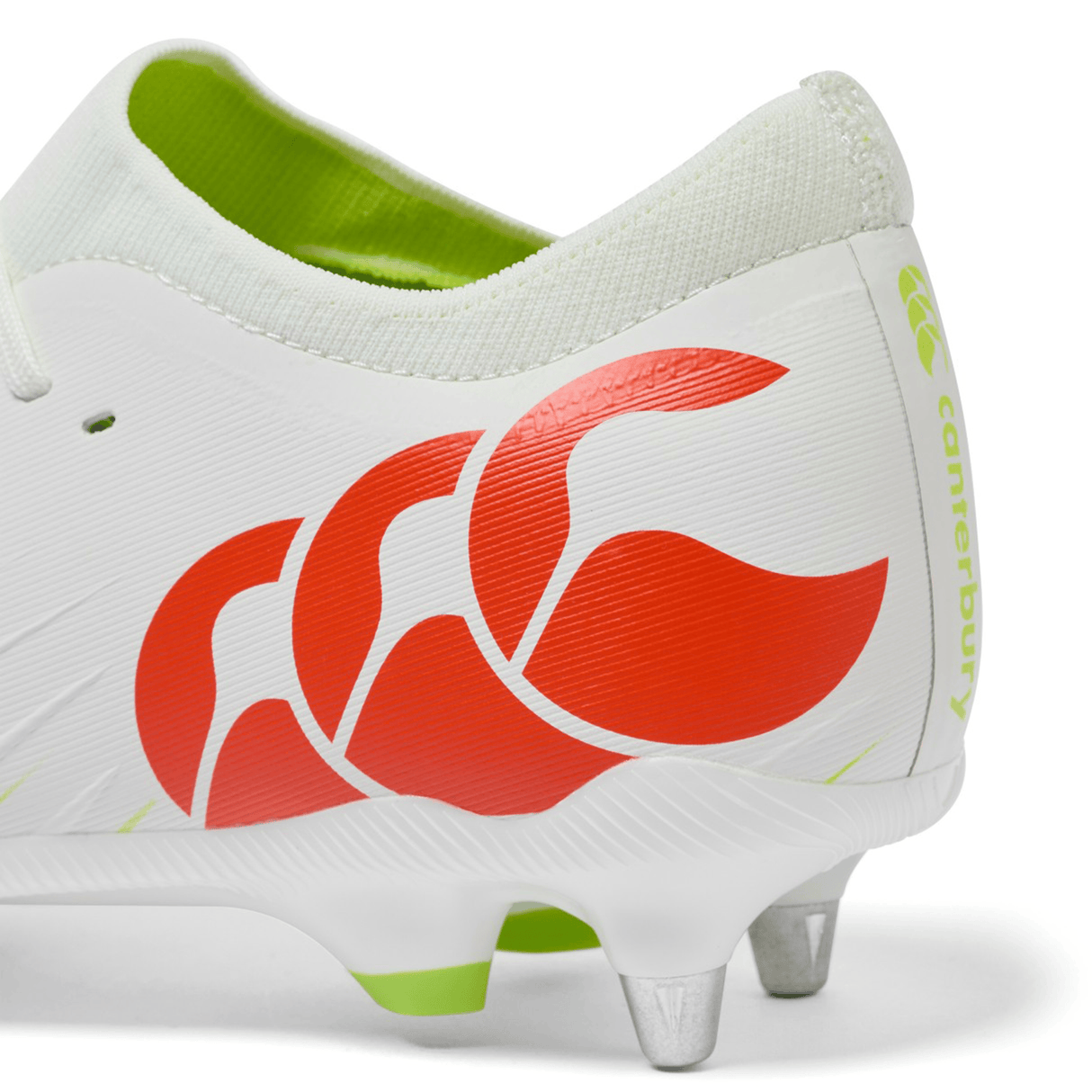 Close-up of the heel of the Canterbury Speed Falcon Pro SG rugby boot in Snow White/Tangerine Tango, showcasing metal studs and a bold Tangerine Tango Canterbury logo on the side.
