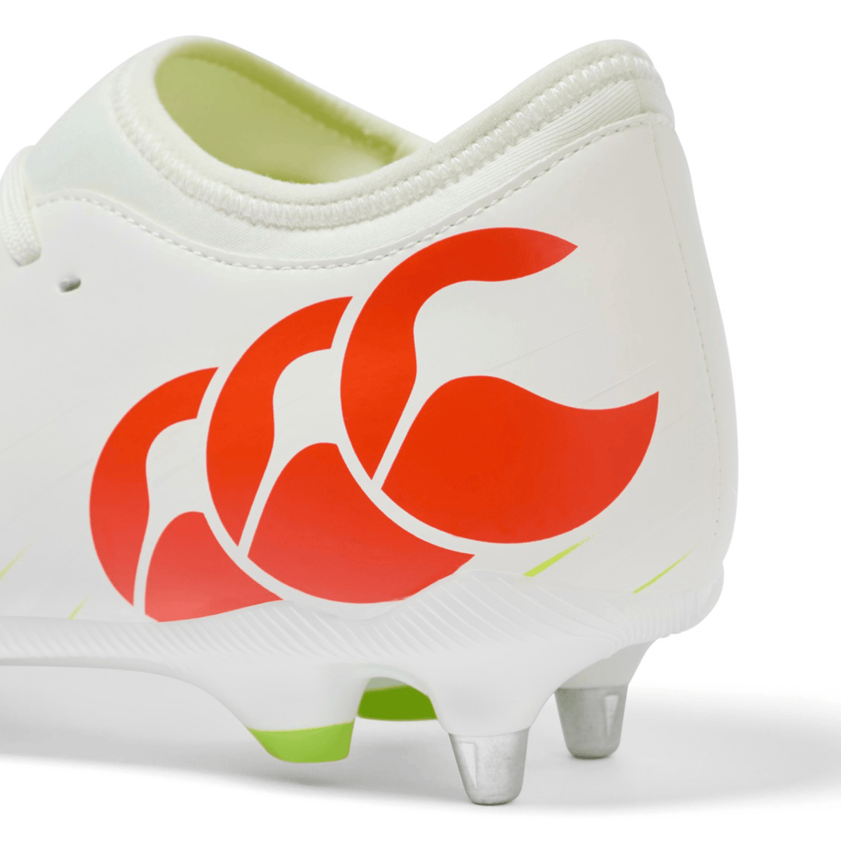 Close-up of the heel of a Canterbury Speed Falcon Team SG rugby boot in Snow White/Tangerine Tango, featuring a red Canterbury logo and metal studs, shot on a white background.