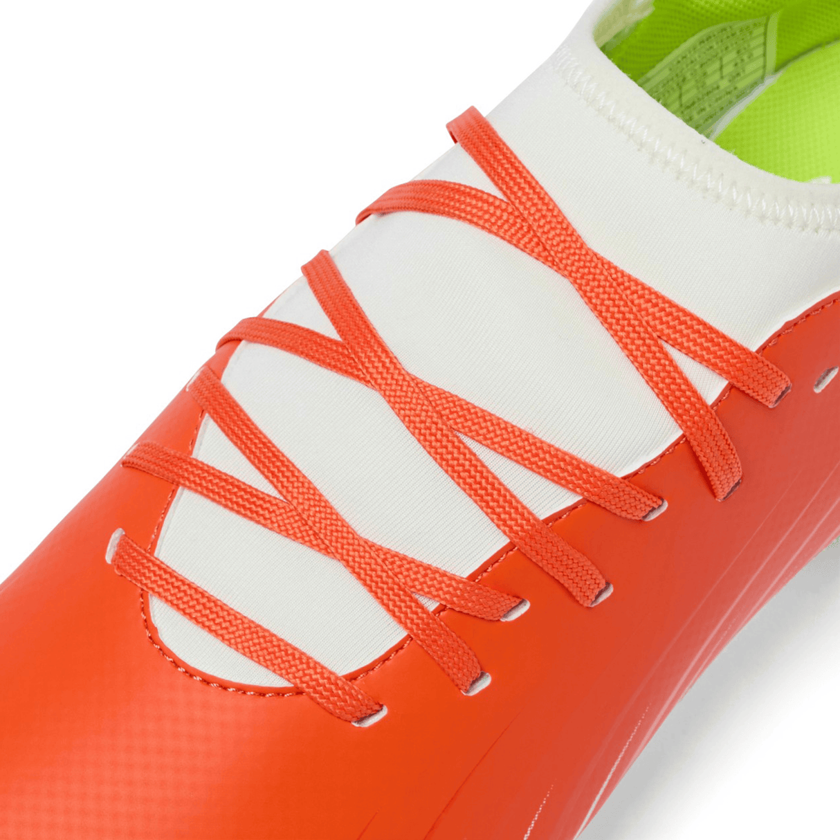 Close-up of the Canterbury Speed Falcon Team SG in Tangerine Tango/Snow White, featuring a white tongue and orange laces arranged in a distinctive crisscross pattern.