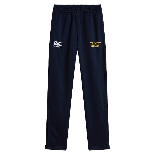 The Trinity College Stretch Tapered Pant by Canterbury, from EMB Canterbury, comes in navy blue with "Trinity Rugby" printed in yellow on the left thigh and the Canterbury logo in white on the right thigh. These stretch tapered pants feature convenient zip pockets, making them perfect for workouts or casual wear.