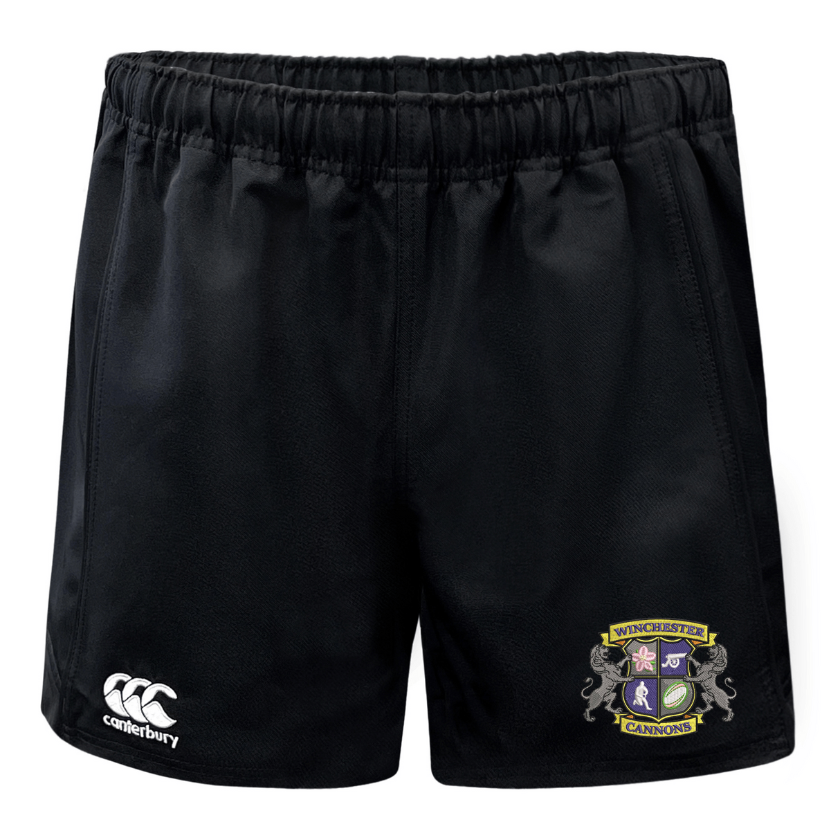 The Winchester Cannons Advantage Short 2.0 by EMB Canterbury features an elastic waistband, white Canterbury logo on the left leg, and a colorful Cannons crest on the right—ideal sustainable sportswear for athletes.