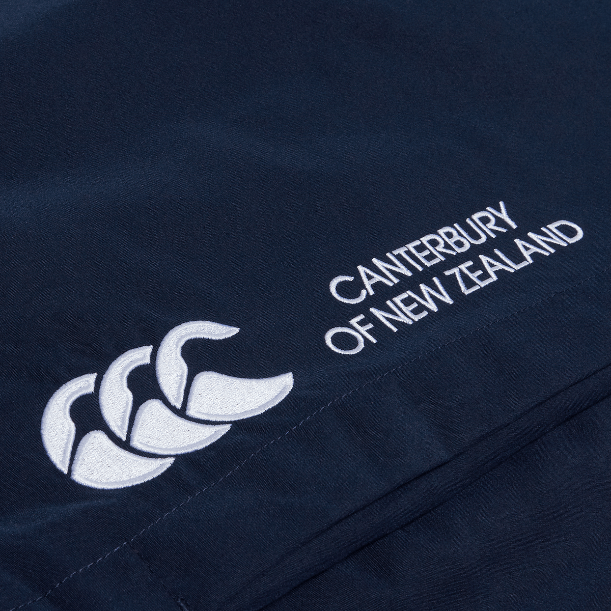 A Canterbury Cuffed Hem Stadium Pant with a white logo on it.