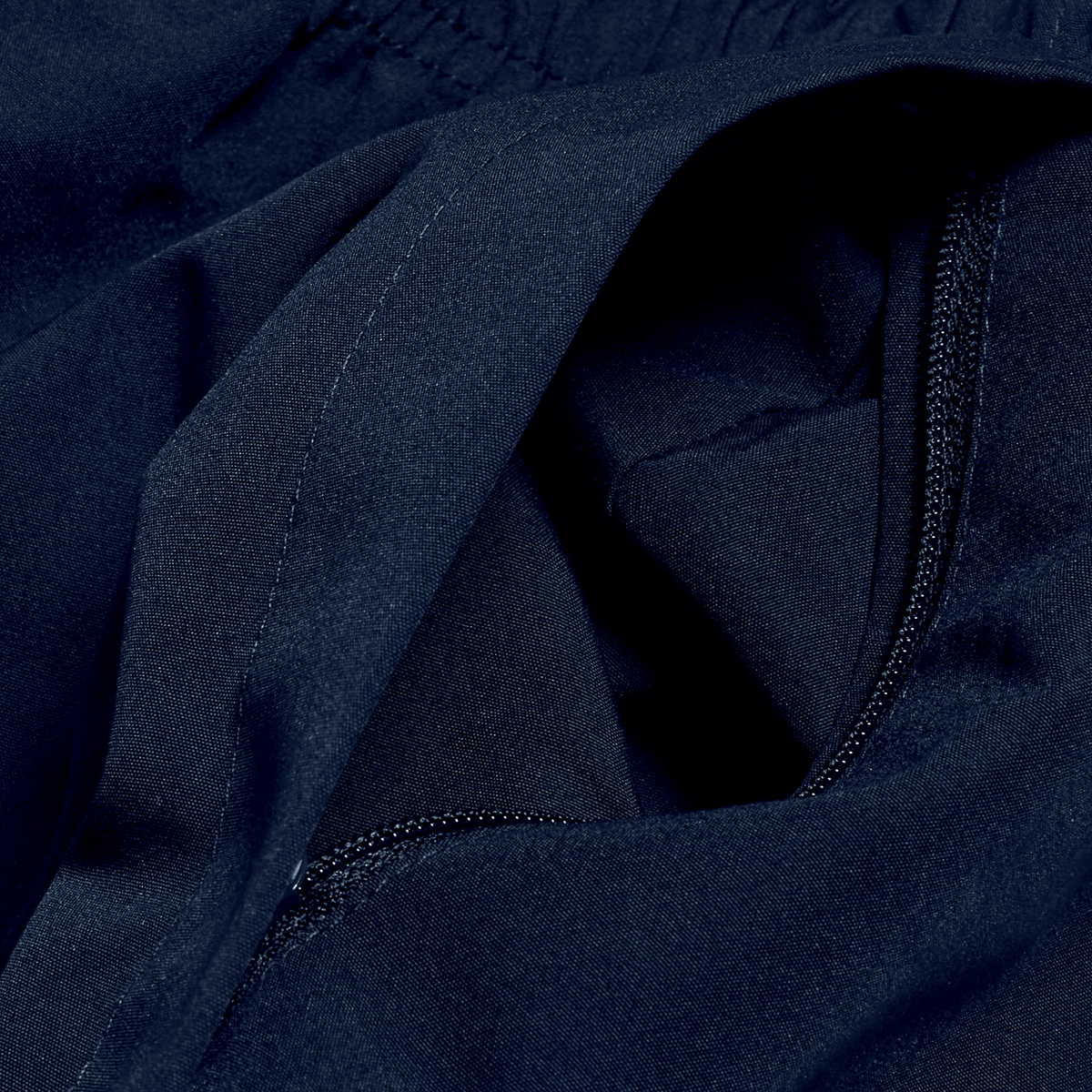 A close up of a Canterbury black jacket with a zipper.