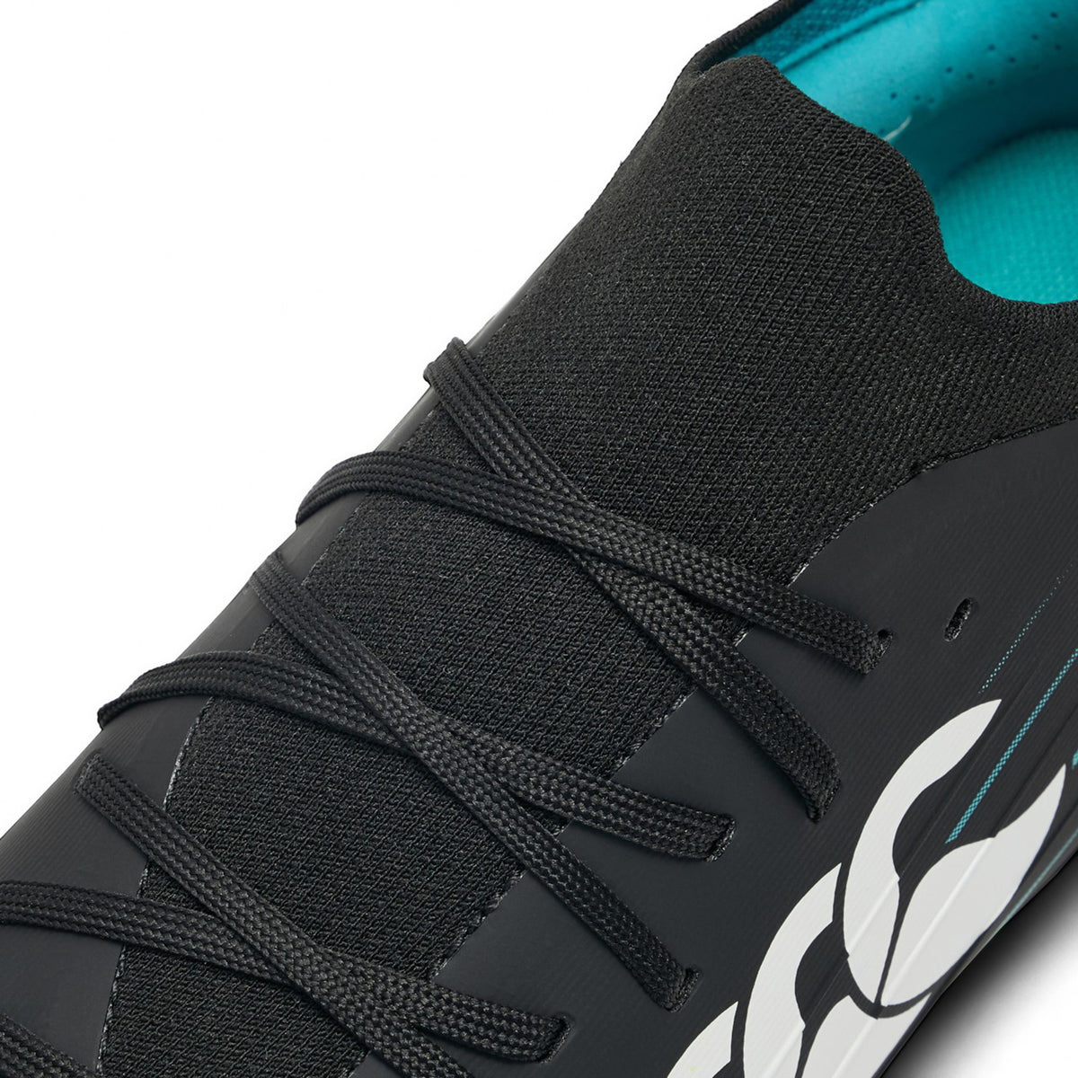 Introducing the Canterbury Speed Falcon 2.0 Pro FG in Jet Black and Baltic Green—a black athletic shoe designed for firm ground, featuring black laces, a distinctive white graphic on the side, and a striking Baltic Green inner lining that delivers both style and lightweight performance.