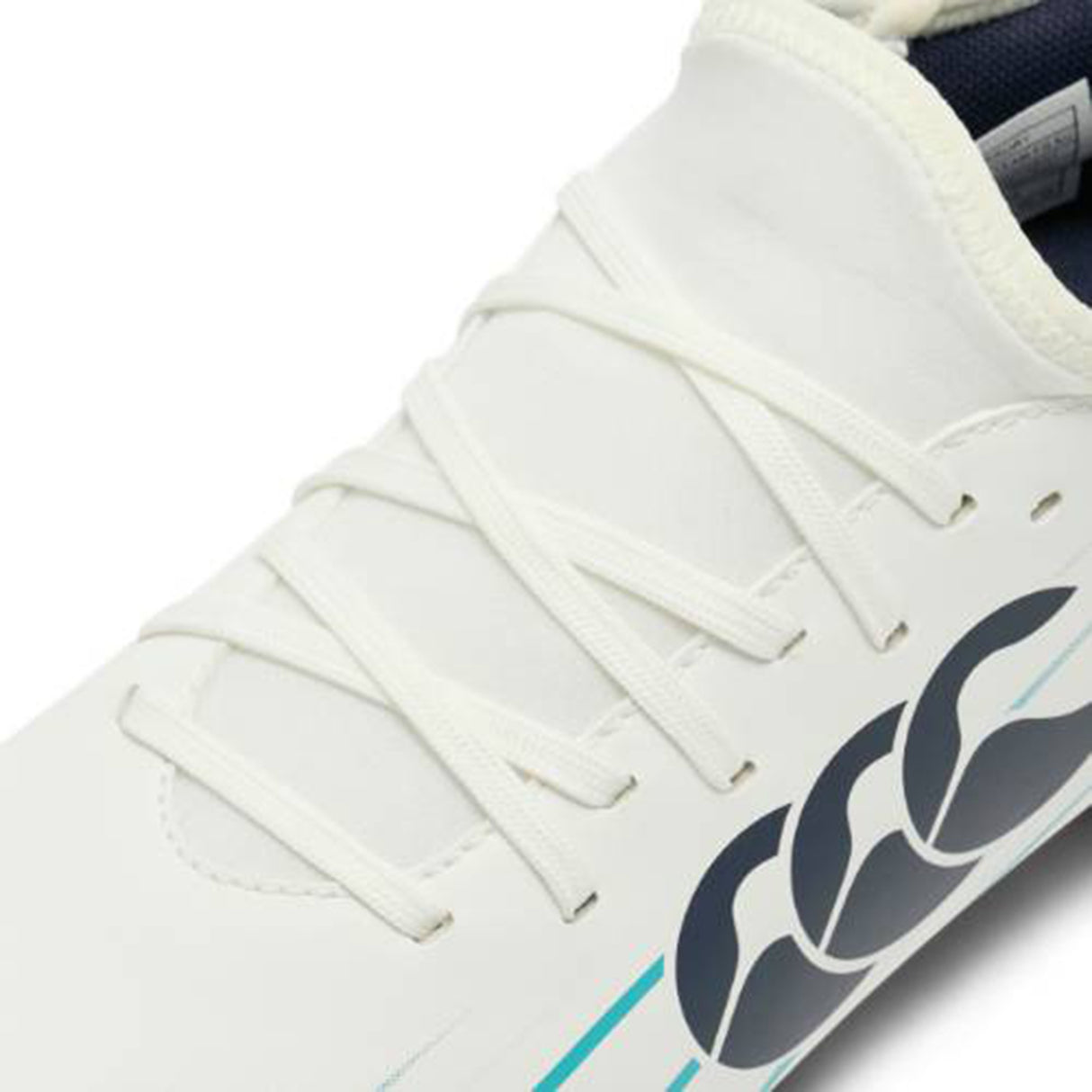 Close-up of the Canterbury Speed Falcon 2.0 Team FG rugby boot in white and Baltic Green, featuring white laces, a blue and black Canterbury logo on the side, and a distinctive curved design detail.