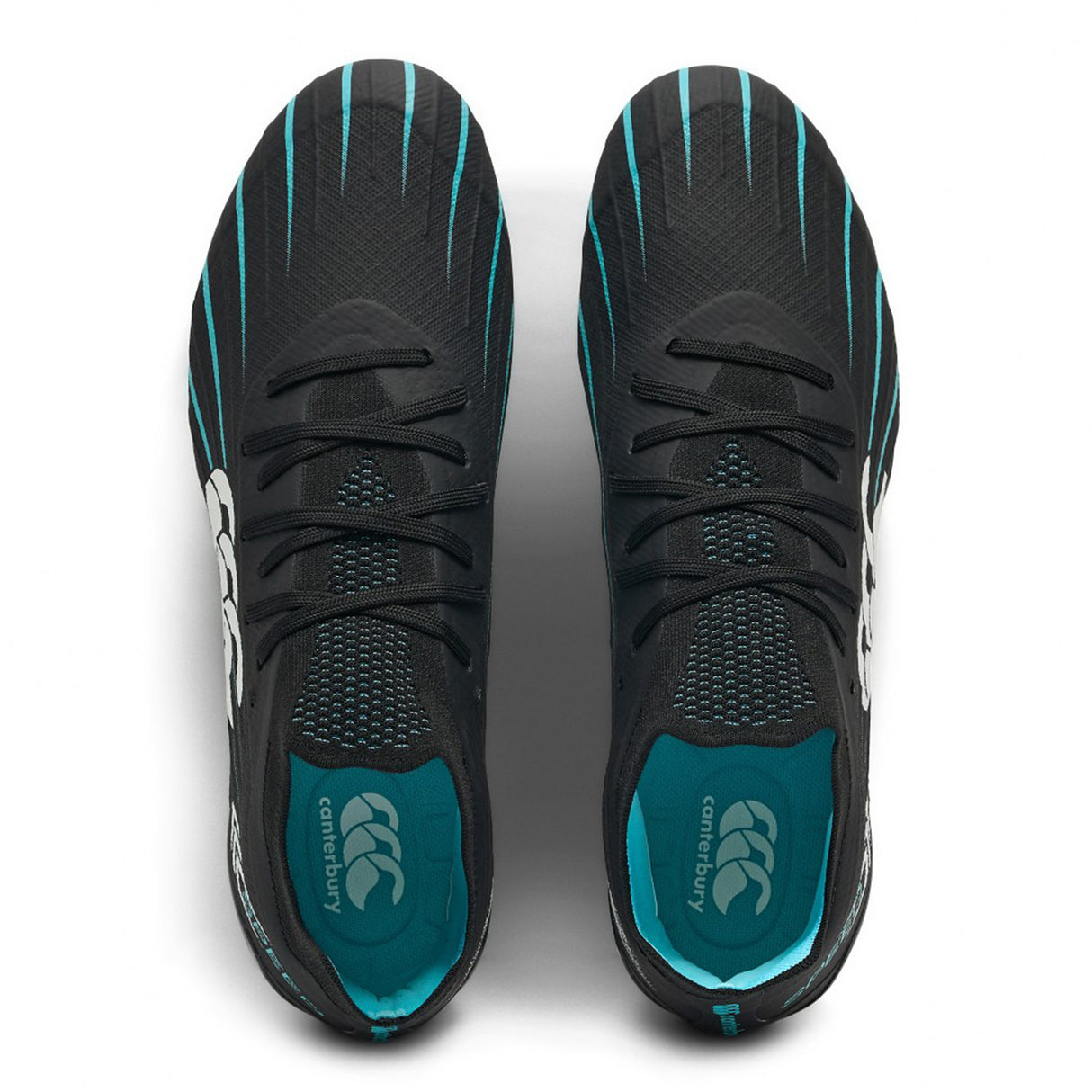 Top view of a pair of Canterbury Speed Falcon 2.0 Elite SG rugby boots in Jet Black and Baltic Green, featuring mesh uppers, laces, and white side logos; placed side by side on a white background—designed by Canterbury specifically for soft ground performance.
