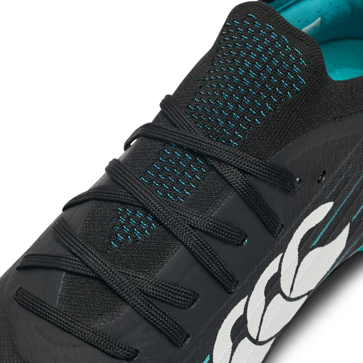 Close-up of a black Canterbury Speed Falcon 2.0 Elite SG rugby boot in Jet Black/Baltic Green, featuring teal stitching, black laces, and a prominent white side design—crafted by Canterbury for peak performance on soft ground.