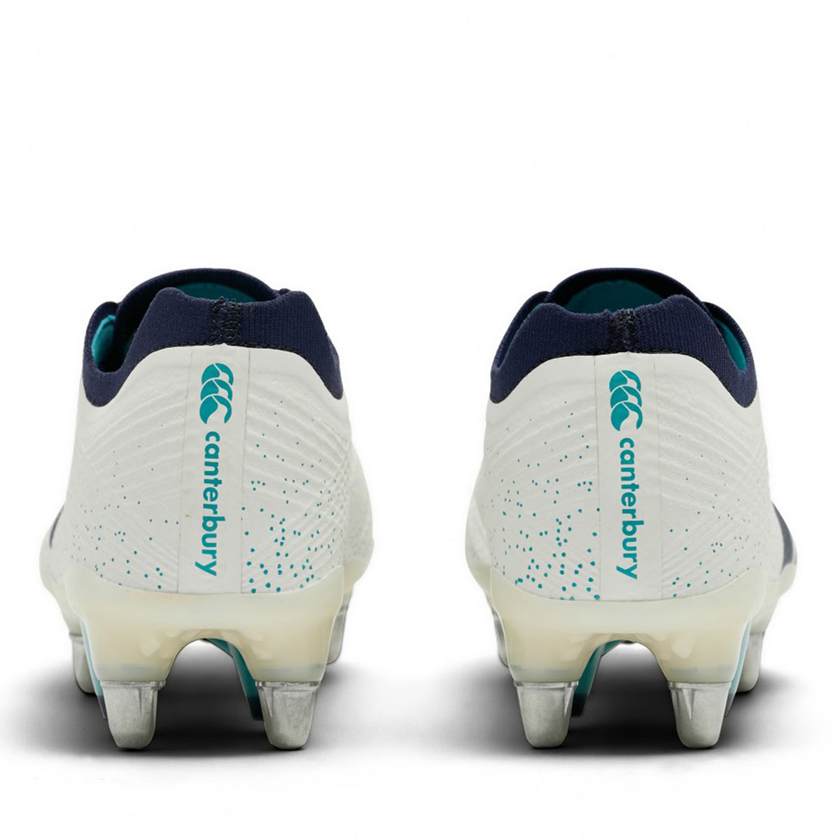 Back view of two white Canterbury Stampede Groundbreak Elite SG Rugby Boots featuring metal studs and teal accents on the heel.