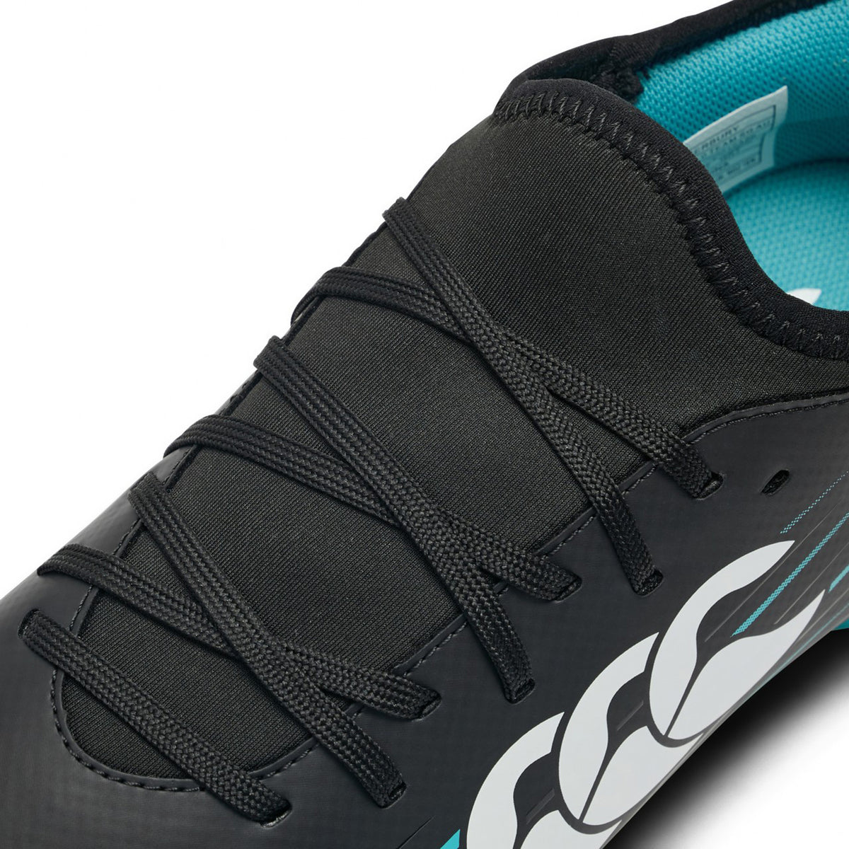 Close-up of the Canterbury Speed Falcon 2.0 Team SG in Jet Black/Baltic Green, featuring black laces, a Baltic Green interior lining, and a bold white graphic on the side—ideal for players seeking lightweight soccer cleats that deliver both standout style and top performance.