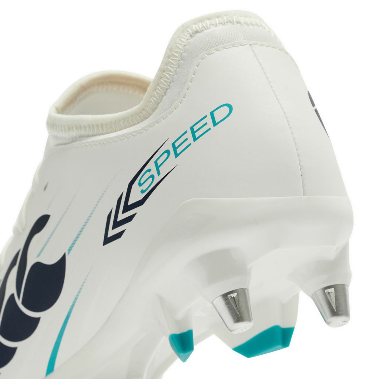 Close-up of the Canterbury Speed Falcon 2.0 Team SG in White/Baltic Green—a lightweight football boot featuring metal studs, "SPEED" printed in blue on the heel, and a black Canterbury logo on the side—ideal for players looking for soft ground boots that offer agility without sacrificing comfort.