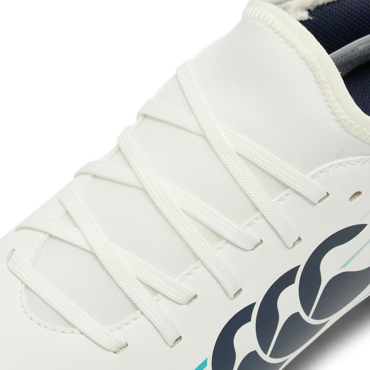 Close-up of the Canterbury Speed Falcon 2.0 Team SG in White/Baltic Green, featuring white laces and a striking blue and black logo on the side, highlighting the sleek design of these Canterbury football boots—perfect for players wanting top performance at a budget-friendly price.