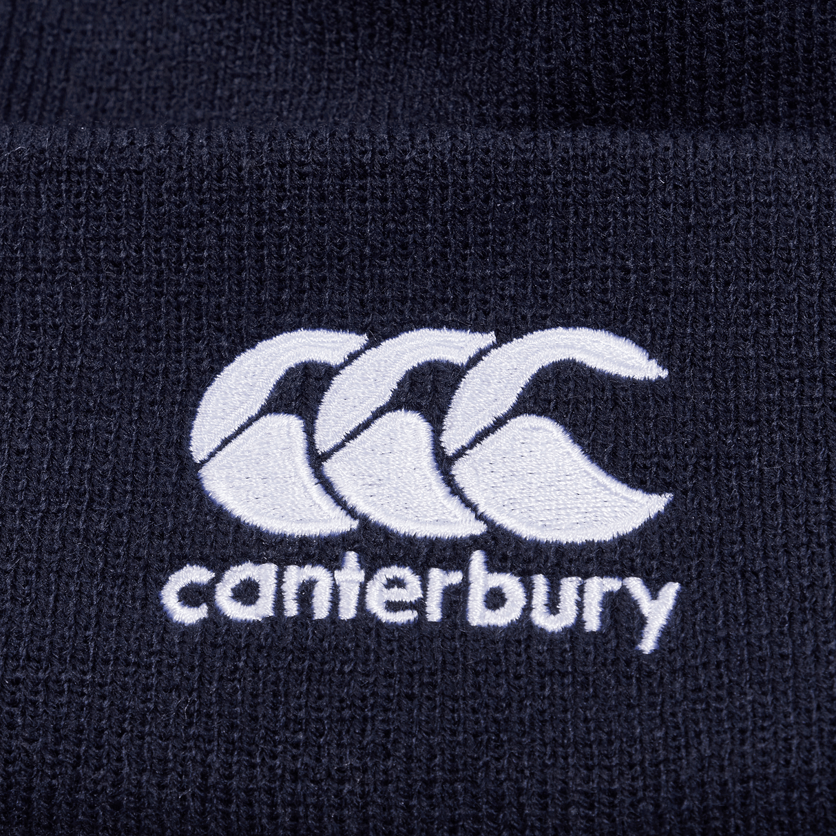 Navy knit beanie with white CCC logo on cuff.