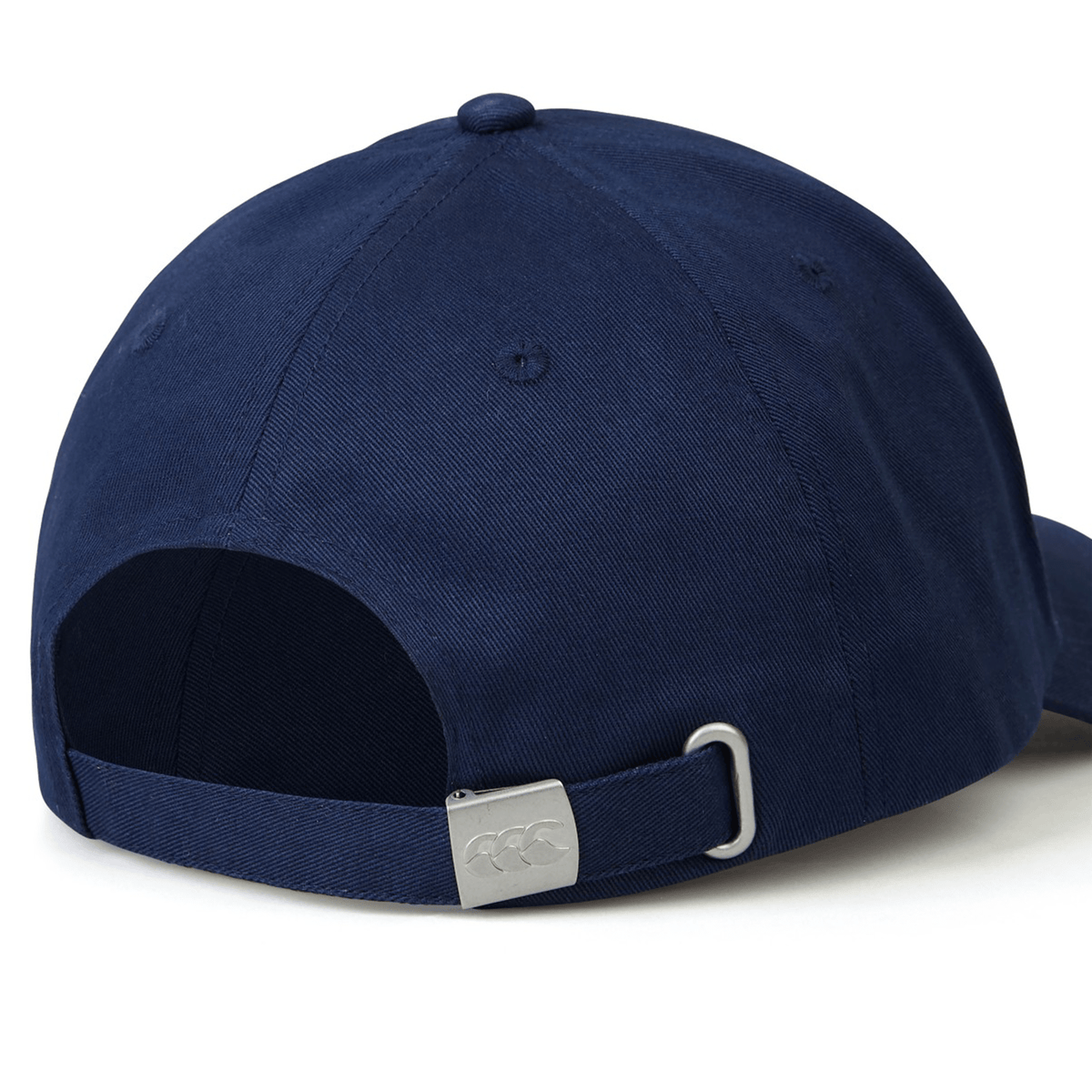 A navy blue Canterbury Flexfit Drill Cap viewed from the back, featuring an adjustable strap and a metal buckle with engraved markings. This comfortable Canterbury cap ensures a perfect fit, blending style and practicality effortlessly.